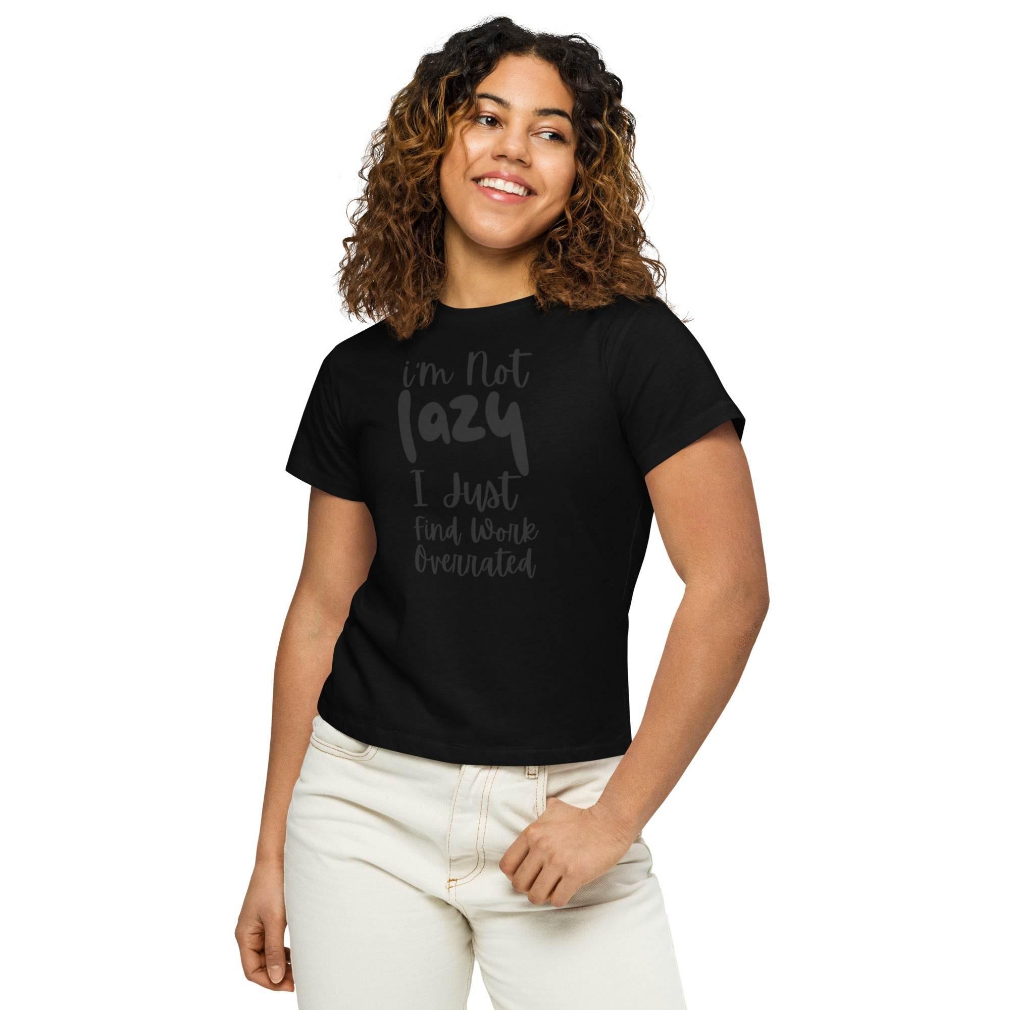 Woman wearing a black cropped graphic t-shirt with the phrase ‘I’m Not Lazy, I Just Need More Energy,’ paired with cream pants — part of the Cropped & Chic Tops collection.- Annaise Store