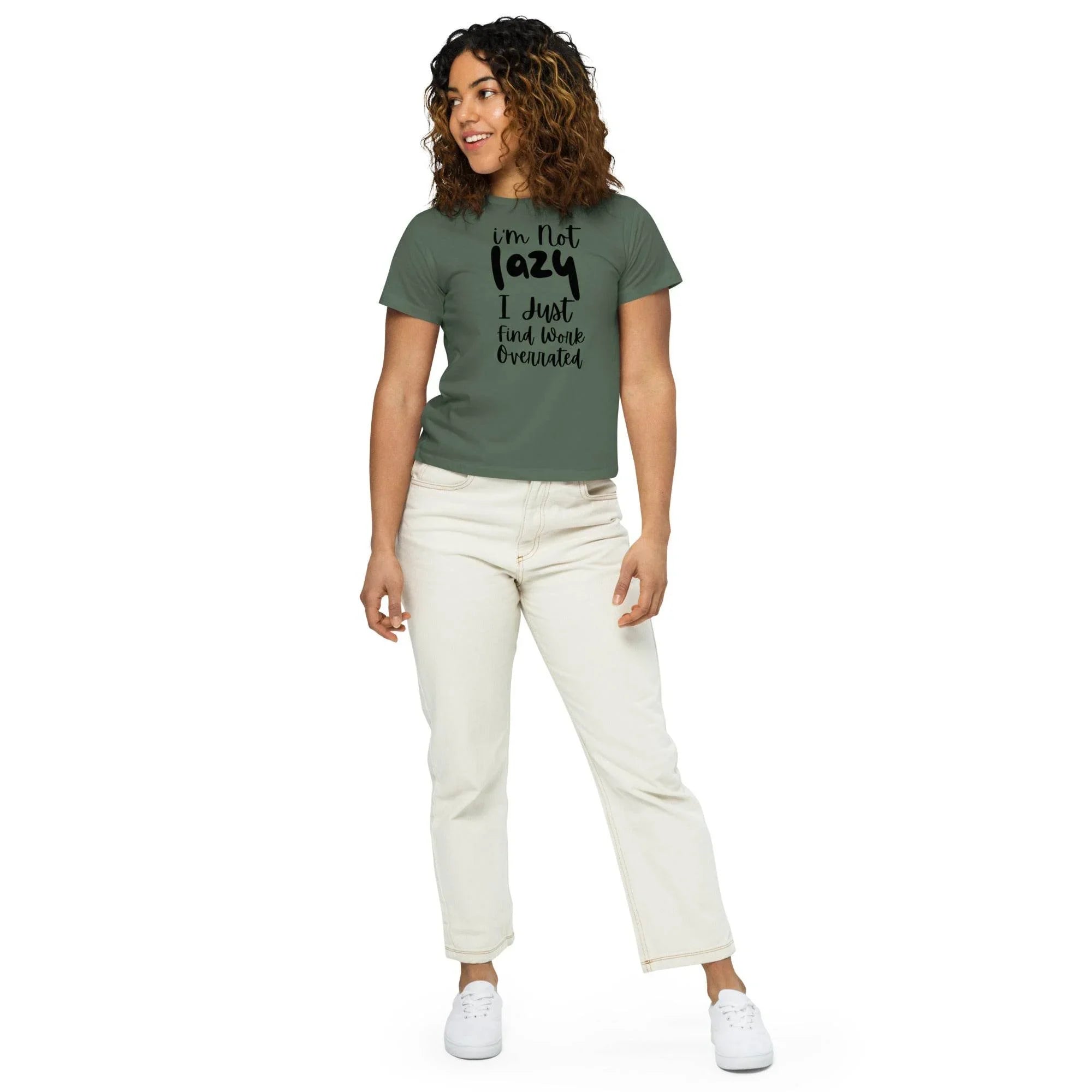 Woman wearing a pine cropped graphic t-shirt with the phrase ‘I’m Not Lazy, I Just Need More Energy,’ paired with cream pants — part of the Cropped & Chic Tops collection. - Annaise Store