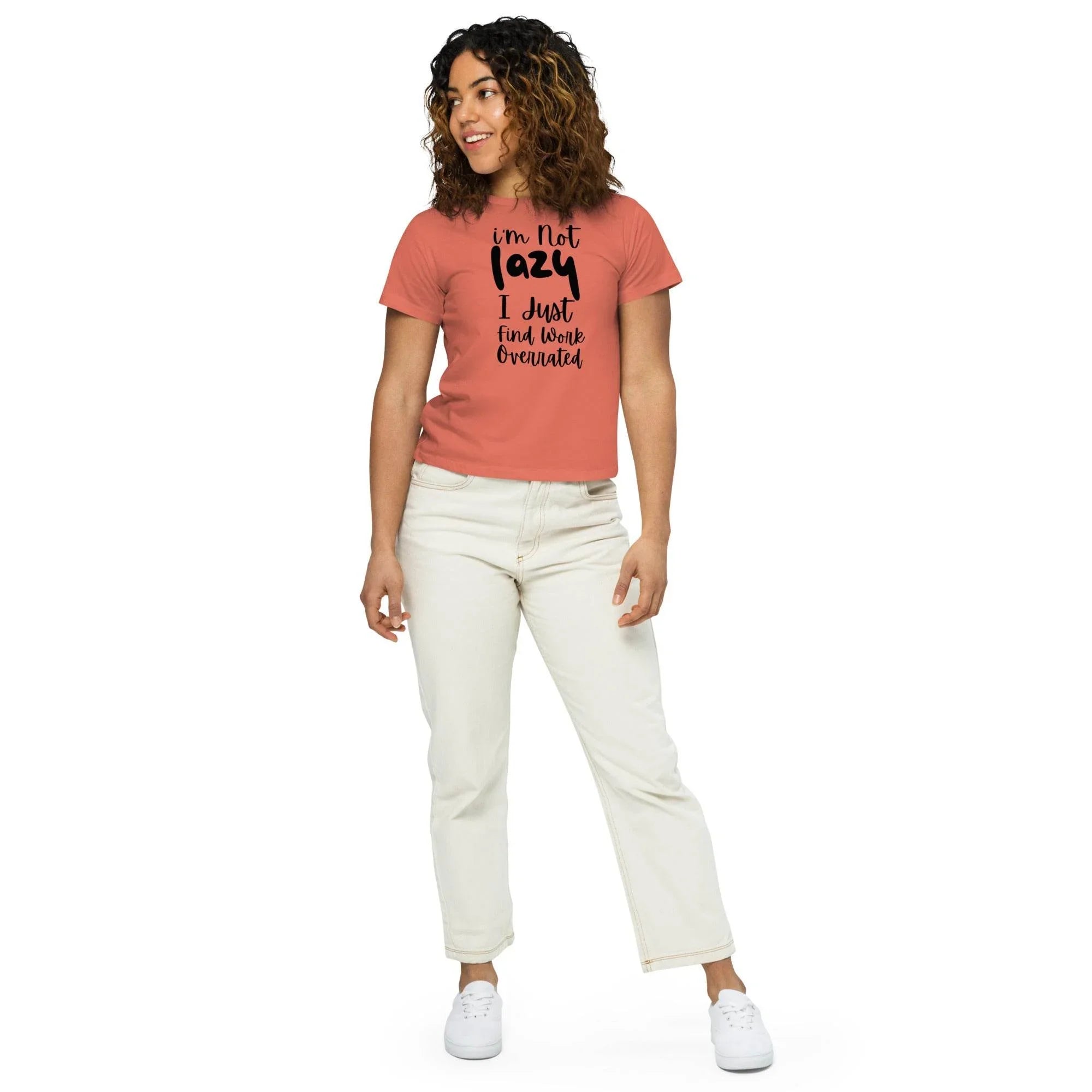 Woman wearing a red-sorbet cropped graphic t-shirt with the phrase ‘I’m Not Lazy, I Just Need More Energy,’ paired with cream pants — part of the Cropped & Chic Tops collection. - Annaise Store
